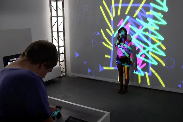 A woman with colorful lines projected on top of her.